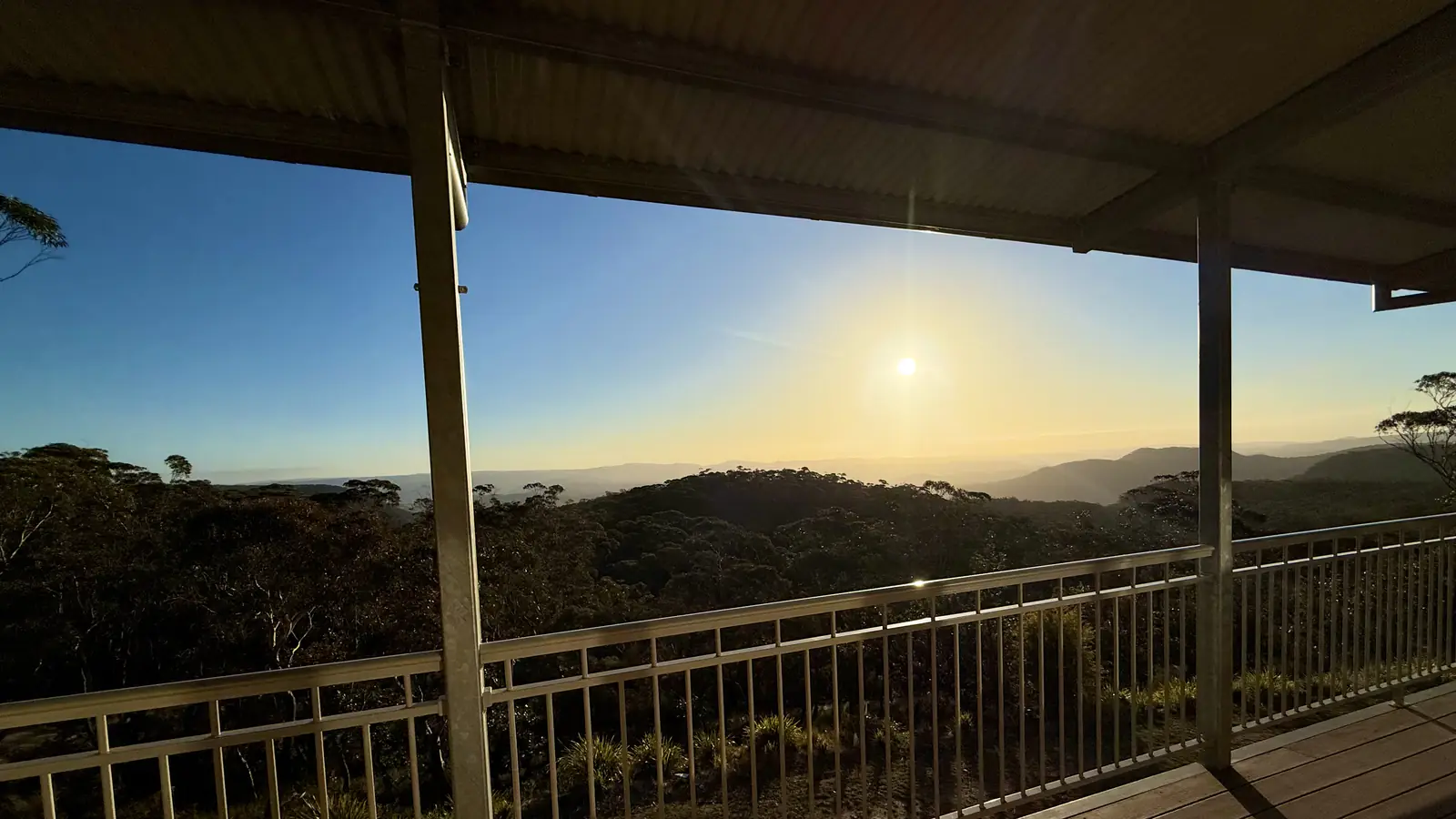 Sunset over the Blue Mountains bushland, seen from a covered verandah at the Dhamma Bhumi Vipassana centre
