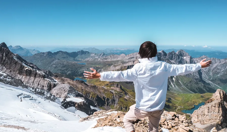Freeman Fung hiking a mountain trail in the Swiss Alps