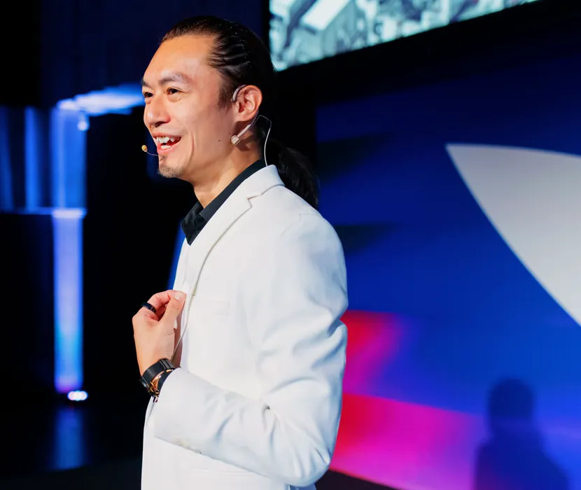 Freeman Fung on stage at Mindvalley University 2024, Tallinn, Estonia
