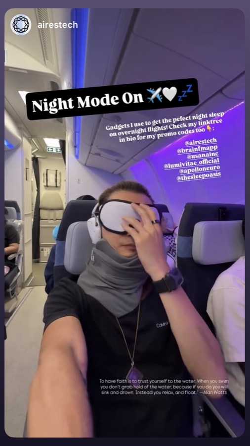 Freeman Fung in night mode on an overnight flight with sleep mask and travel pillow