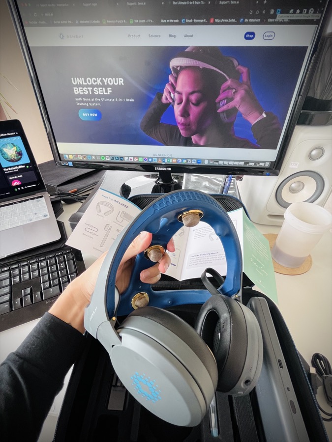 Sens.ai neurofeedback headset unboxed on a desk setup
