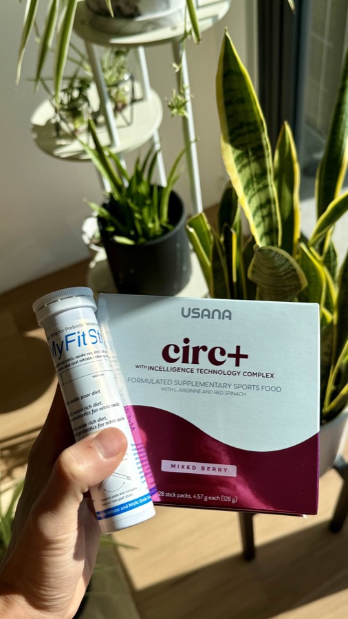 USANA Circ+ sports supplement box held with a MyFitStrip tube